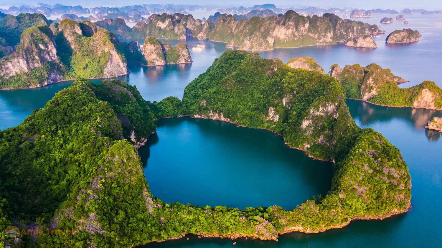 Ha Long Bay October November clear golden light limestone karst peaks calm emerald water cruise junk best time visit