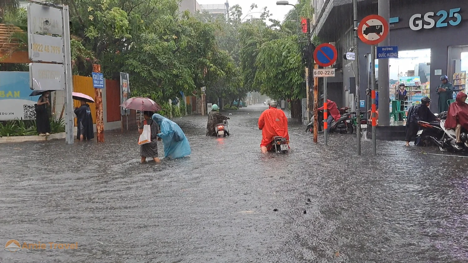 Ho Chi Minh City street after afternoon monsoon rain, steam rising from the wet tarmac, city continuing to function, evening street food setting up, fresh air