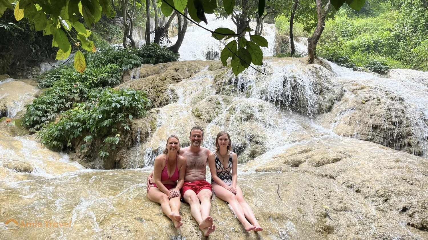 Hieu Waterfall Pu Luong July August full summer volume limestone multiple tiers lush green forest dramatic cascade