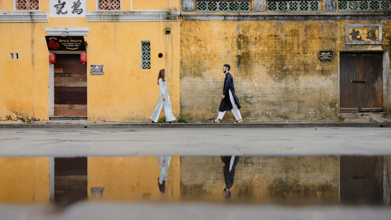 Hoi An Ancient Town rain lanterns reflected wet stone lane yellow facades atmospheric October November rainy season