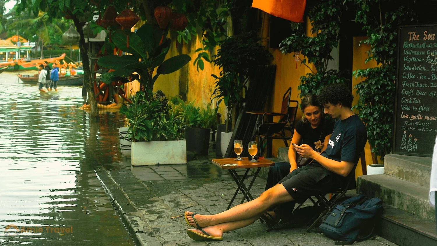 Hoi An Ancient Town flooded street October lanterns shallow water yellow houses atmospheric moody rainy season